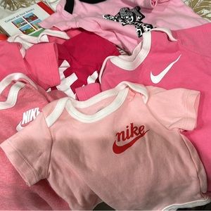 7 nike onesies